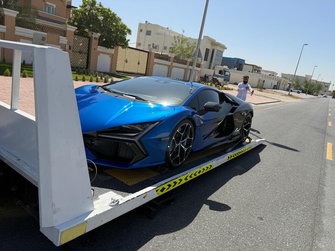 Blue Lamborghini Revuelto loaded on a flatbed in Dubai